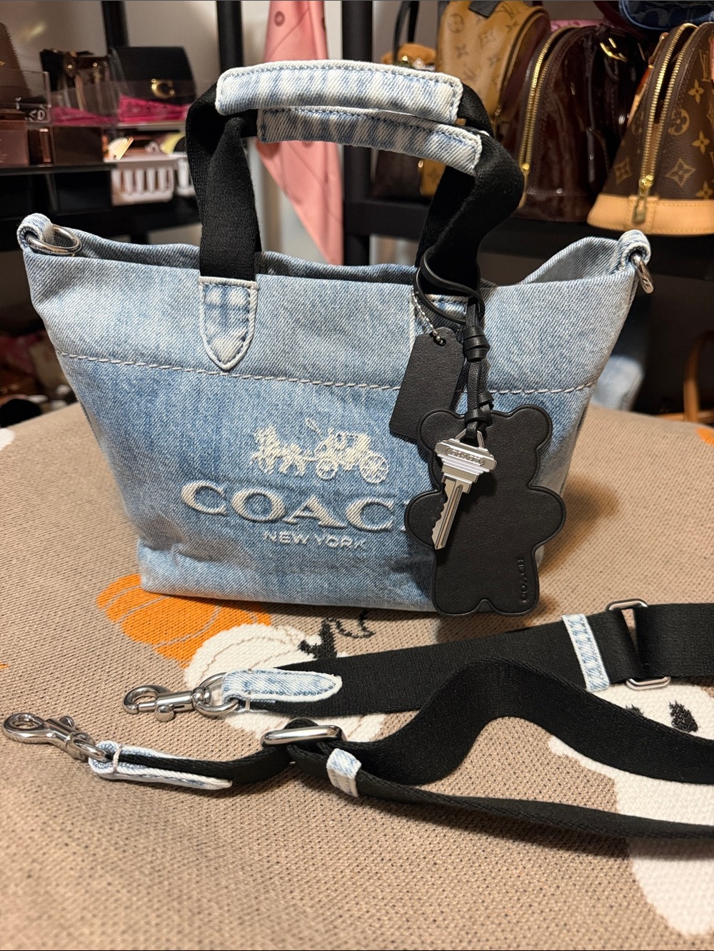 Coach mini tour tote in light wash denim